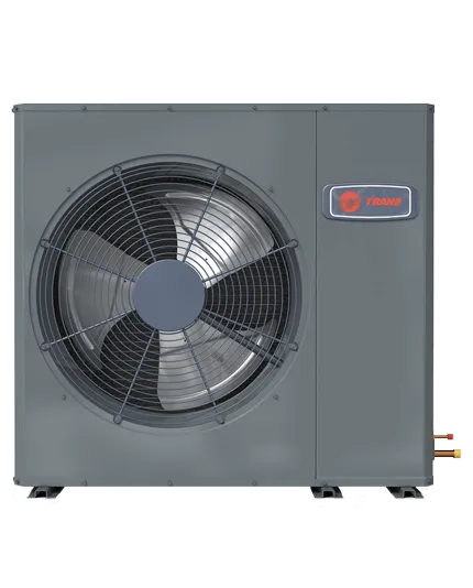 A gray Trane outdoor air conditioning unit featuring a large front-facing fan and exposed copper piping on the right.